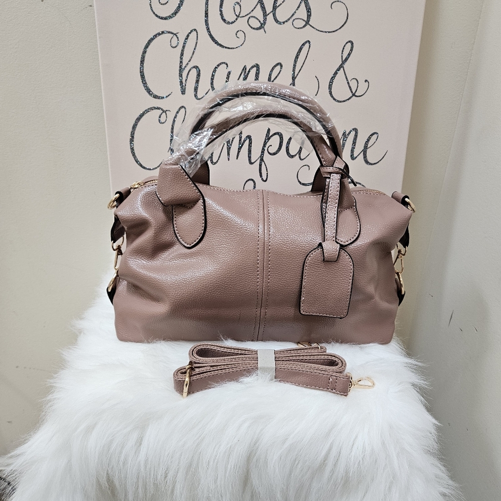NEW MAUVE FAUX LEATHER BOSTON BAG.